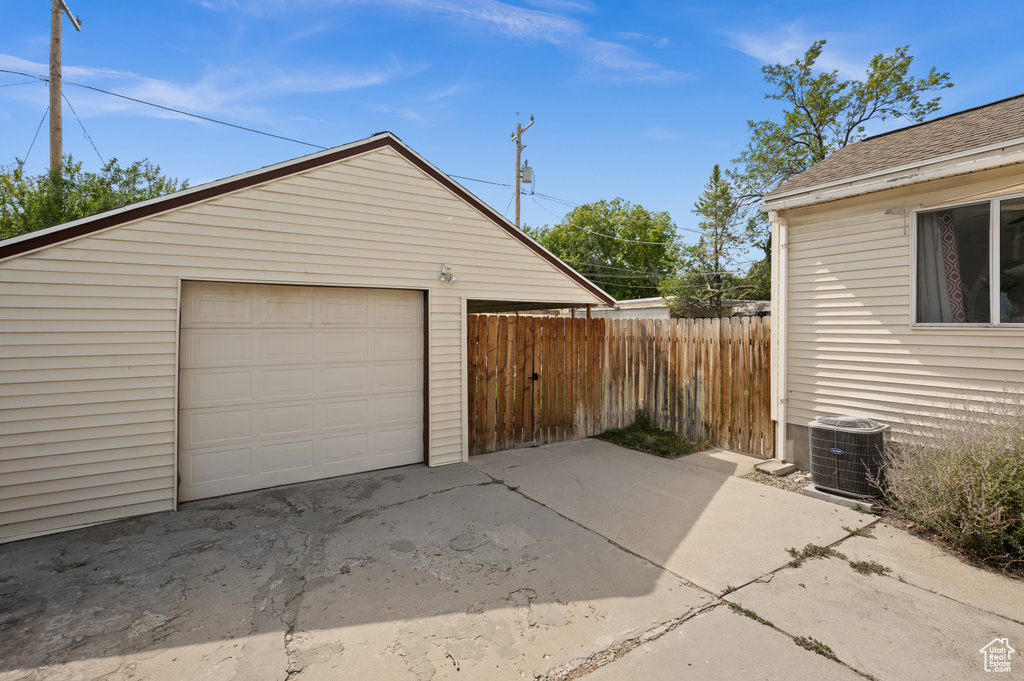 Detached garage with concrete driveway