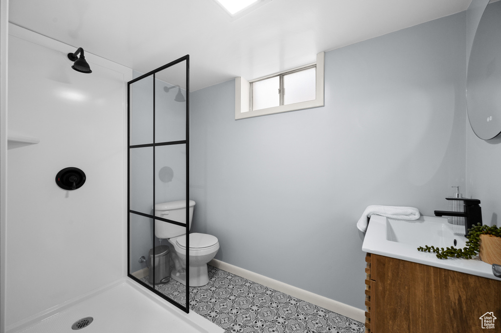 Bathroom with vanity and a walk in shower