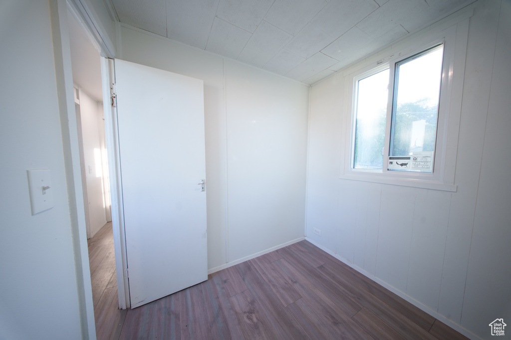 Empty room featuring wood finished floors