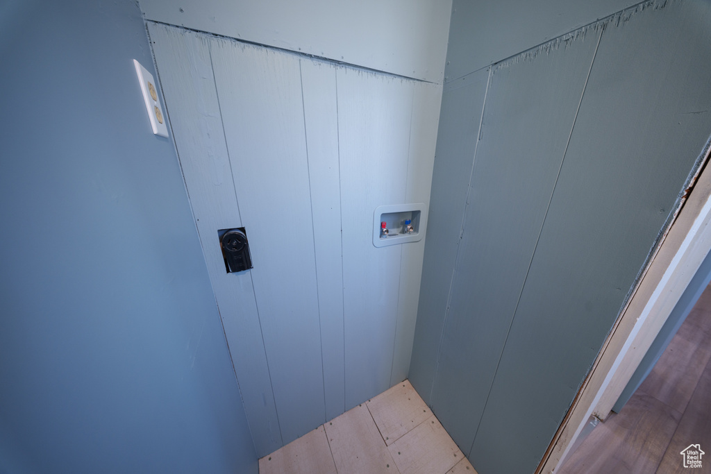 Washroom featuring hookup for a washing machine and hookup for an electric dryer
