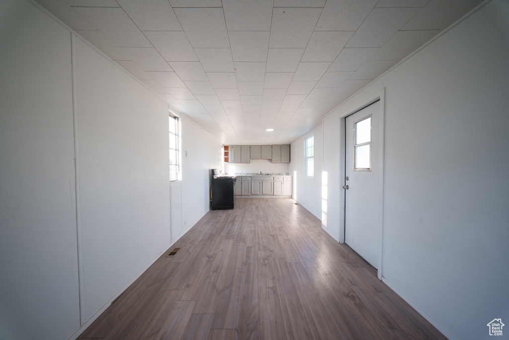 Hallway featuring dark wood-type flooring