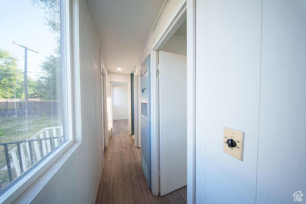 Corridor with wood finished floors