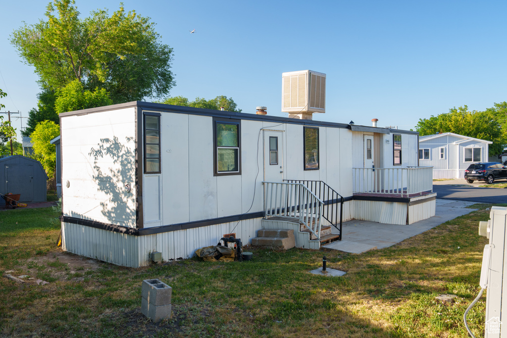 View of front of house with a front yard