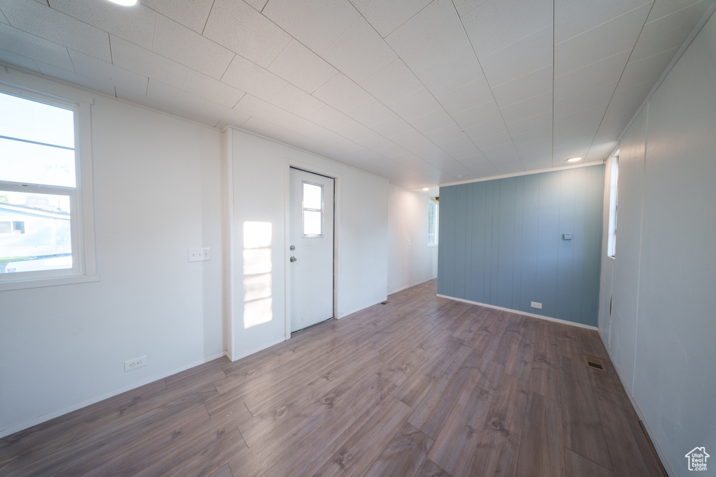 Spare room featuring wood finished floors