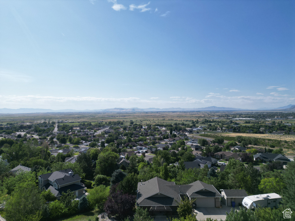 View of property location with a mountain backdrop and nearby suburban area