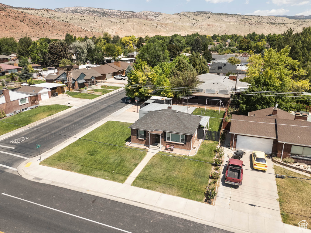 Aerial view of residential area with a mountainous background