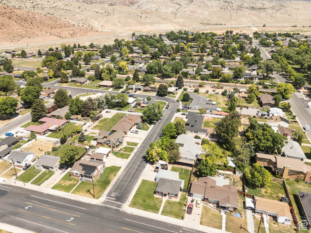 Aerial overview of property's location with nearby suburban area