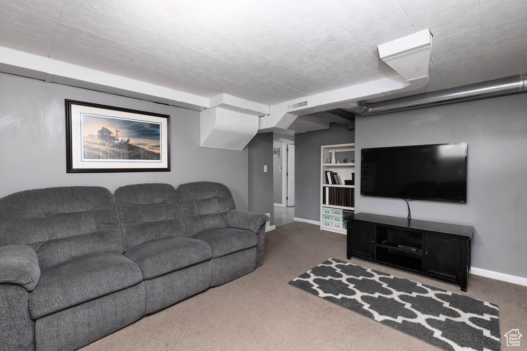 Living room featuring carpet flooring and baseboards