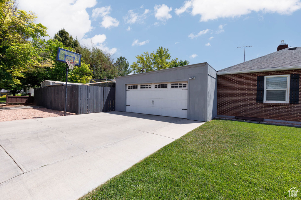 Garage with concrete driveway