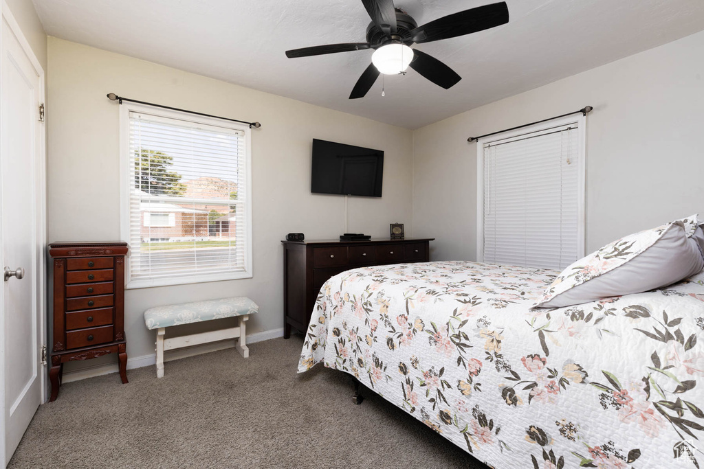 Bedroom with carpet floors and a ceiling fan
