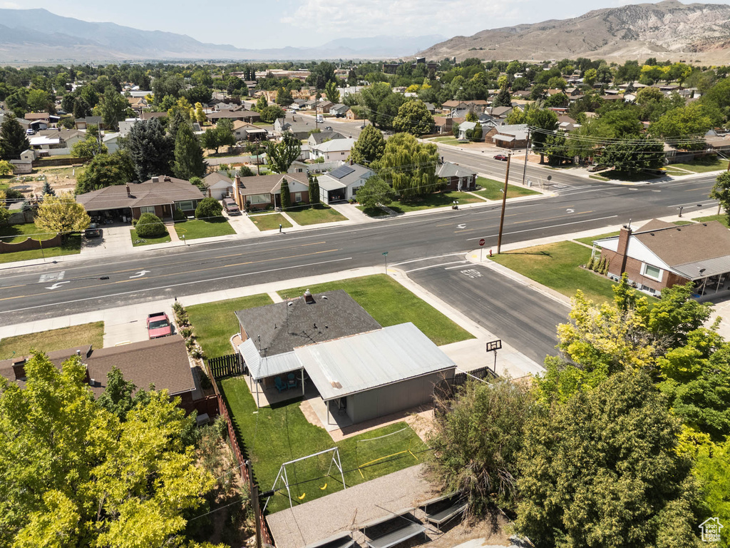 Aerial perspective of suburban area featuring a mountain backdrop