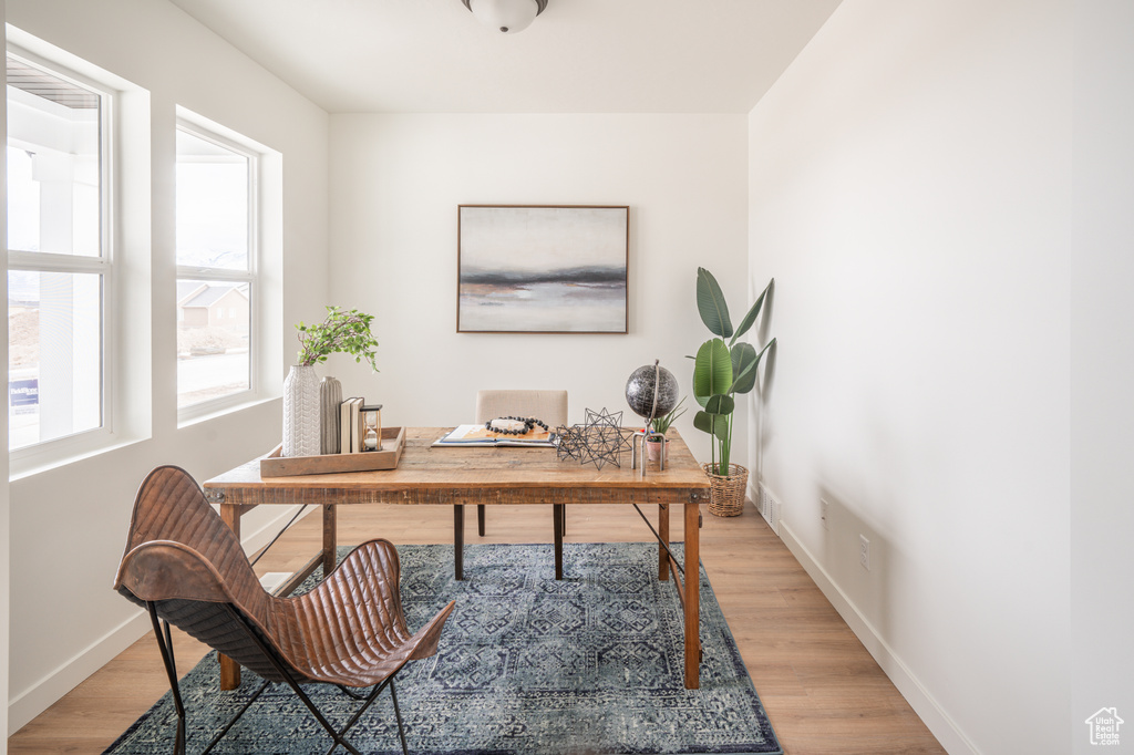 Office featuring baseboards and light wood finished floors
