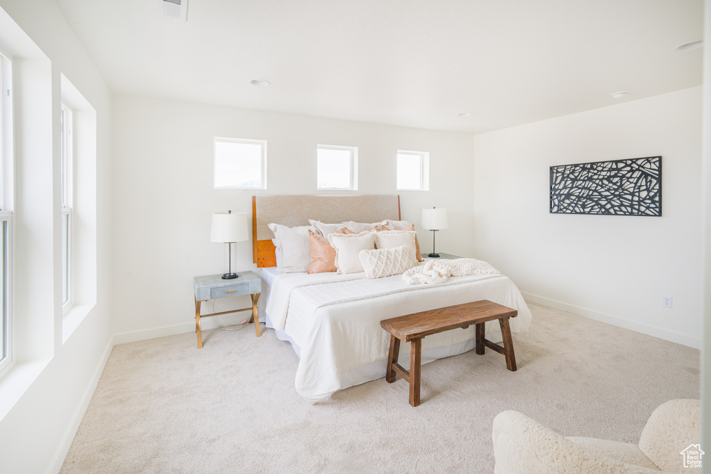 Carpeted bedroom with baseboards