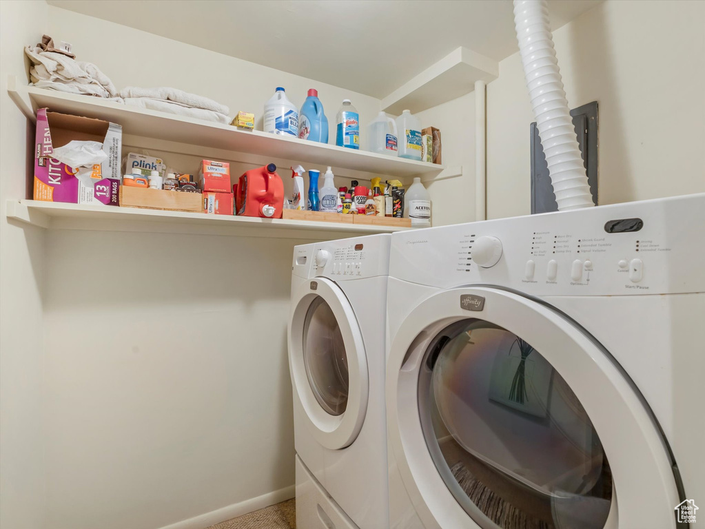 Washroom featuring washing machine and clothes dryer