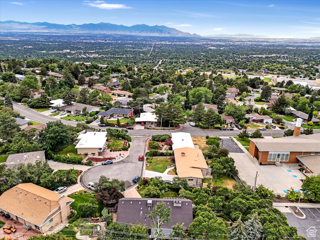 Aerial view of residential area featuring a mountain backdrop