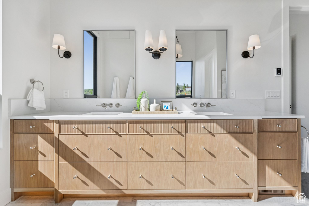 Full bath featuring double vanity