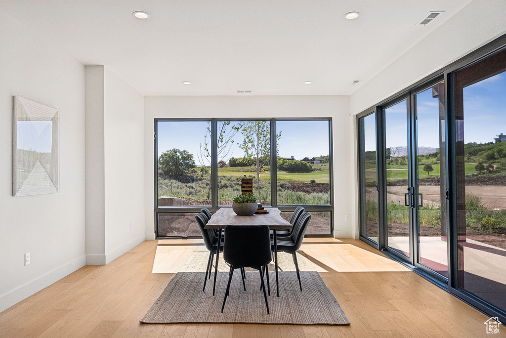Dining room featuring light wood-style floors and recessed lighting