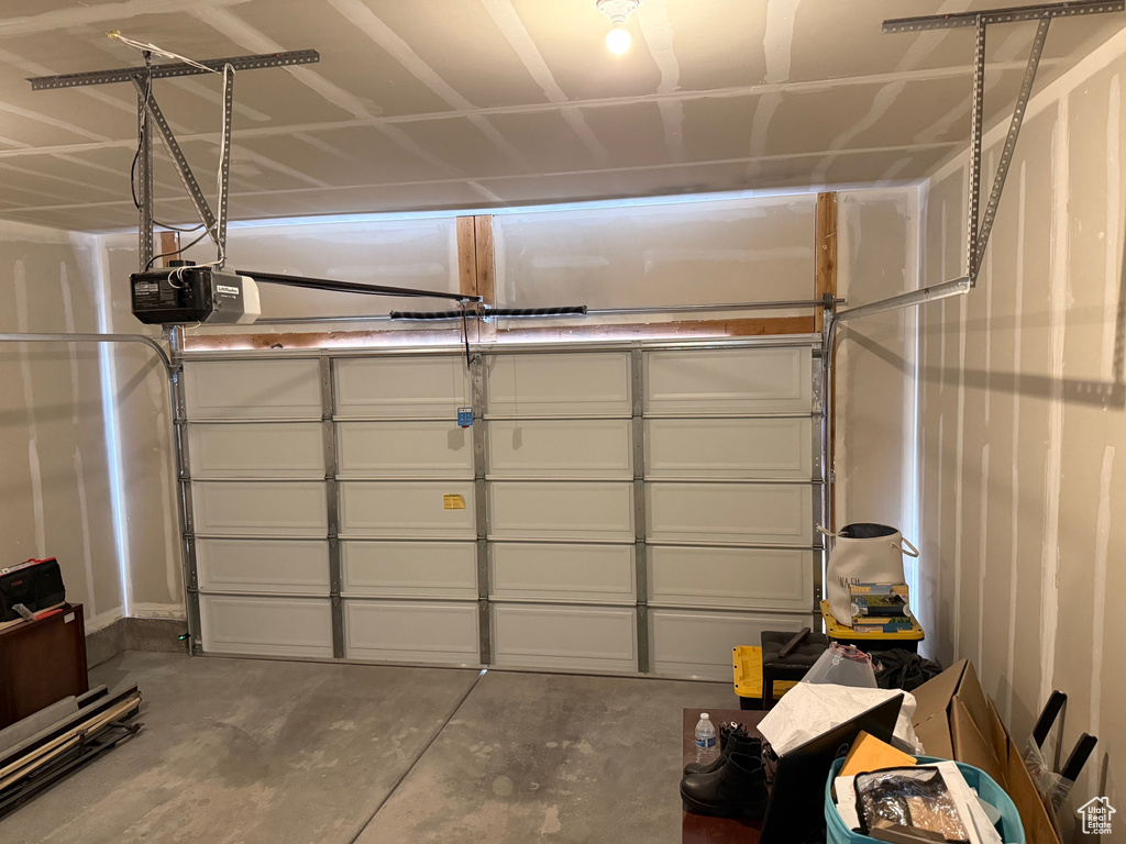 Garage featuring a garage door opener