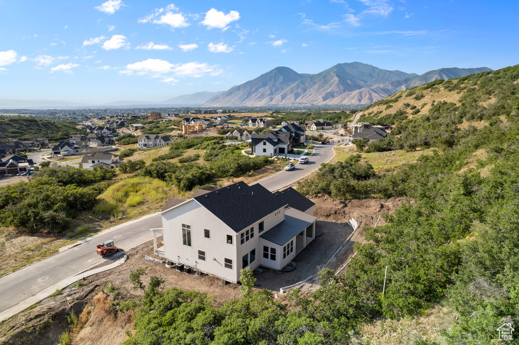 Aerial perspective of suburban area with a mountain backdrop