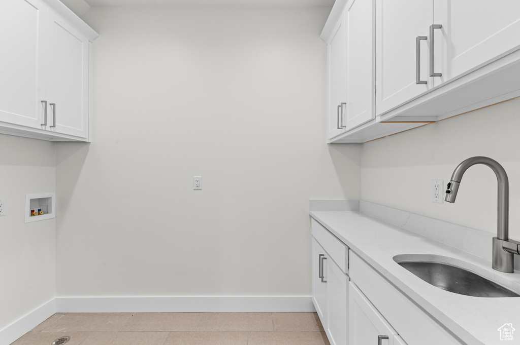 Laundry area with cabinet space and hookup for a washing machine