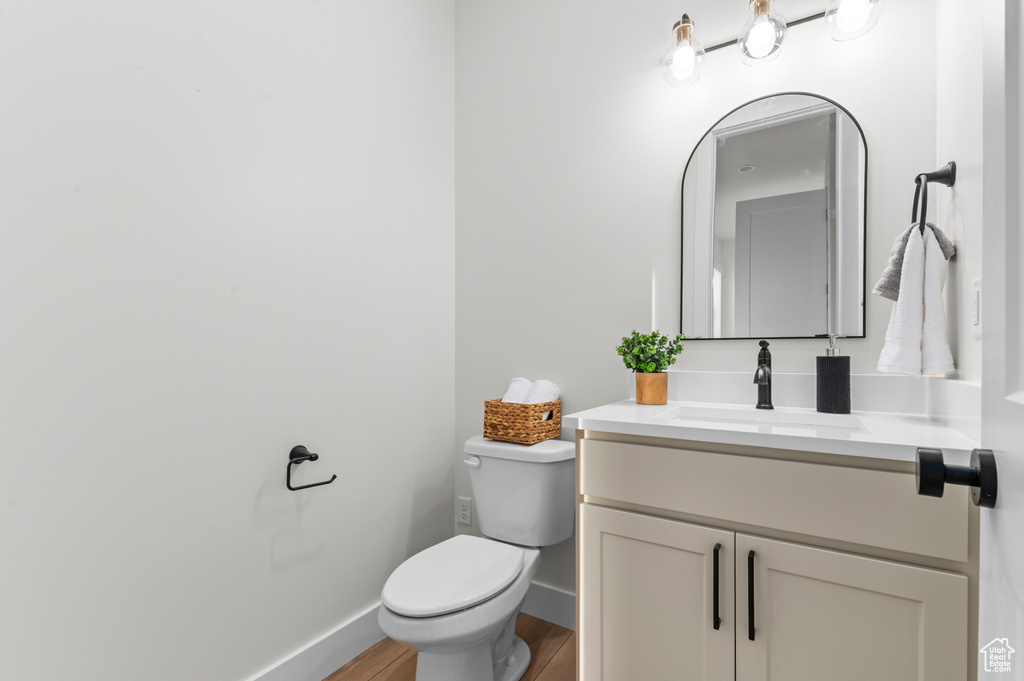 Bathroom with vanity and wood finished floors