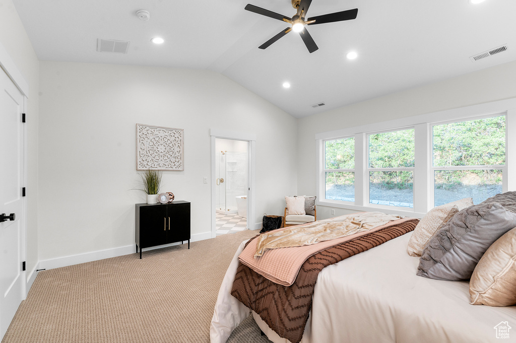 Bedroom featuring lofted ceiling, light colored carpet, recessed lighting, connected bathroom, and a ceiling fan