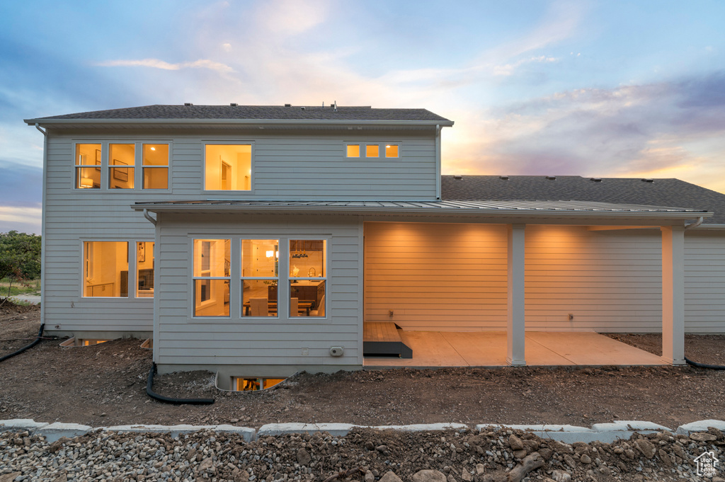 Rear view of house with a patio