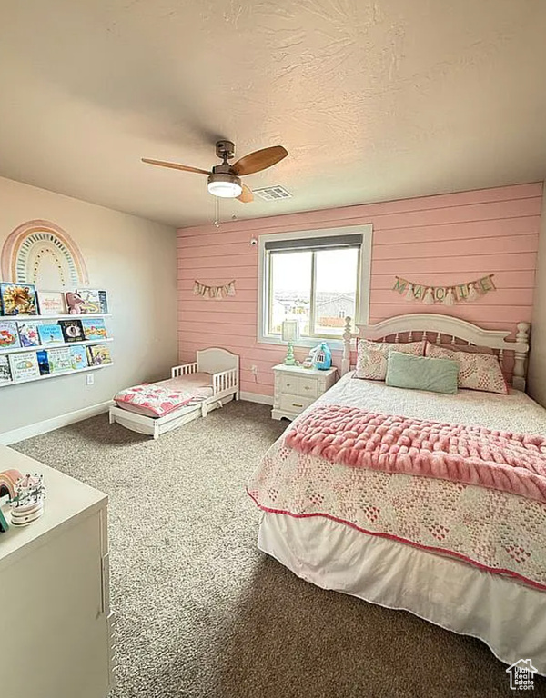 Bedroom featuring carpet and a ceiling fan