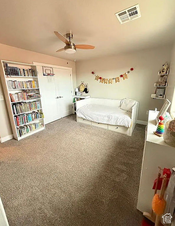 Bedroom with carpet flooring and a ceiling fan