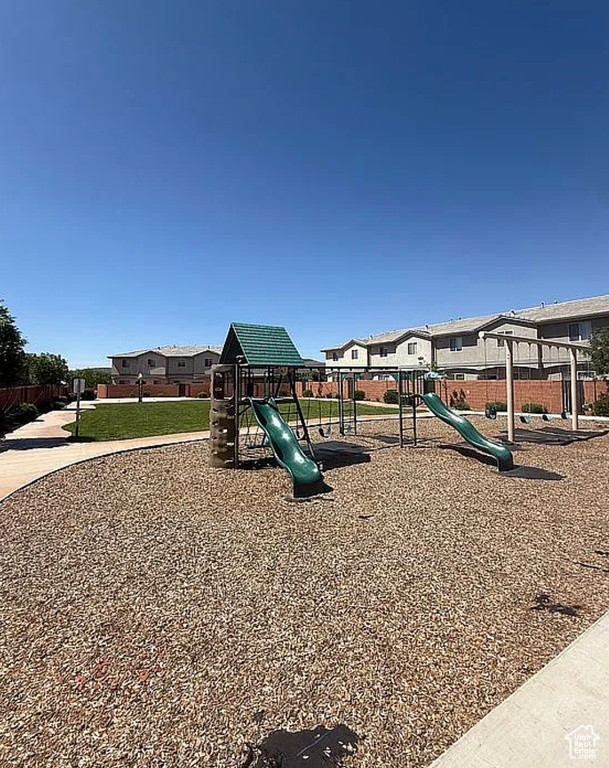 Community playground featuring a residential view