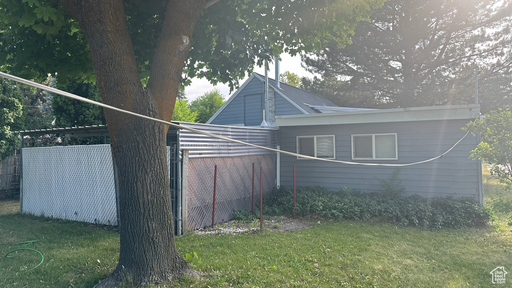 View of home's exterior featuring a lawn
