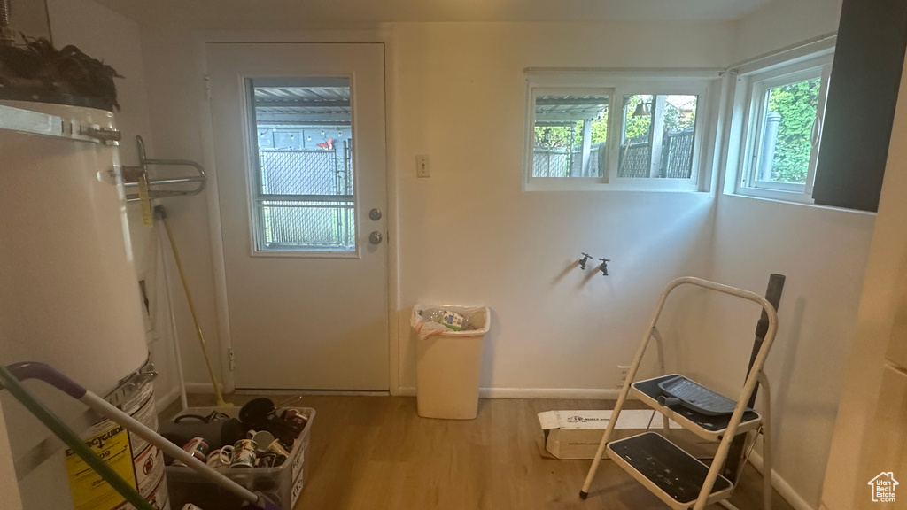 Doorway featuring wood finished floors