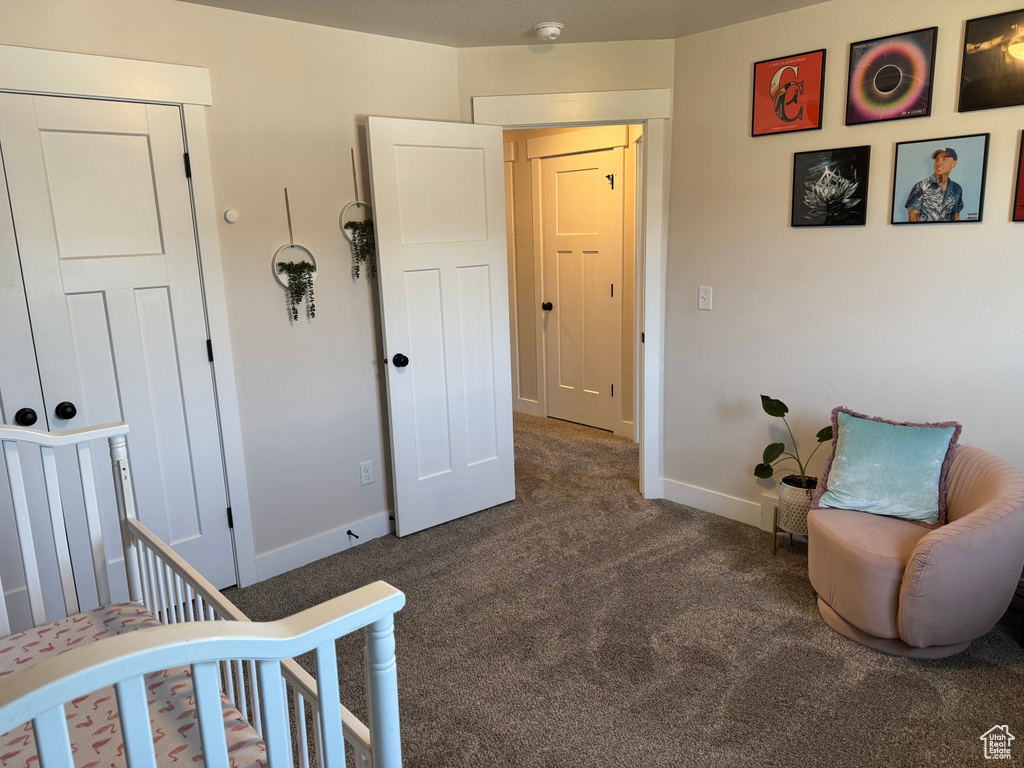 Bedroom with carpet floors and baseboards