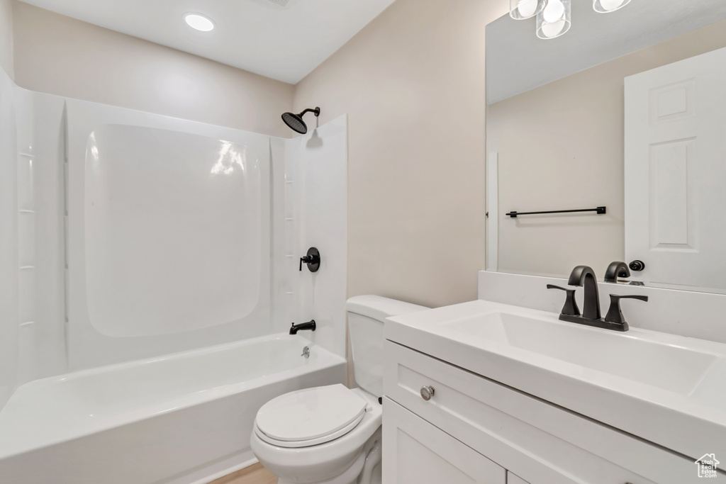 Bathroom with vanity and bathing tub / shower combination
