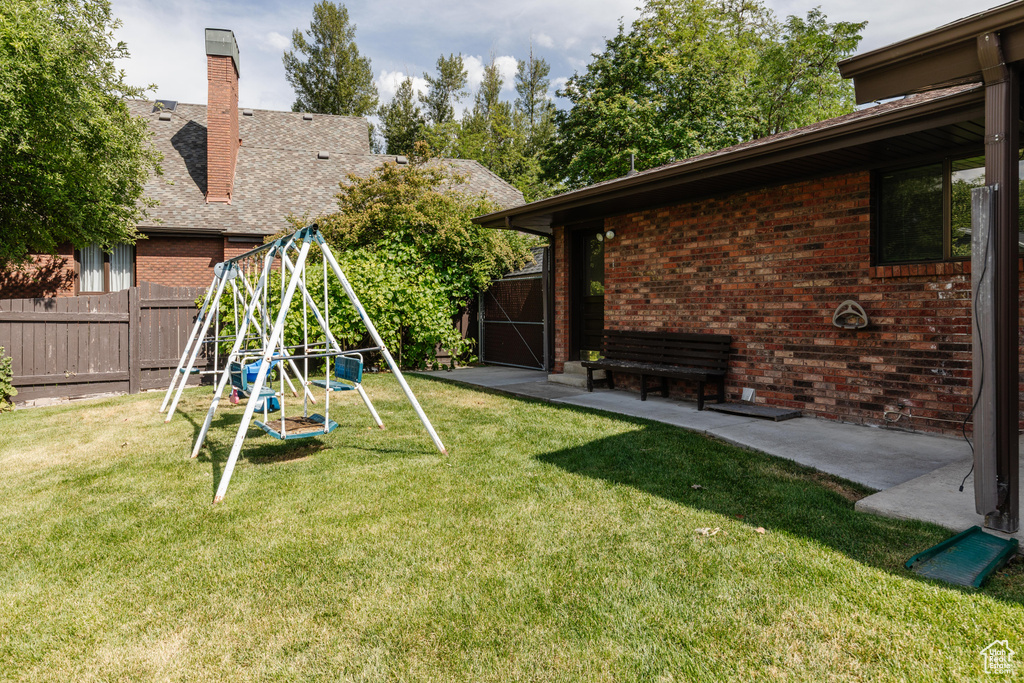 View of yard featuring a playground