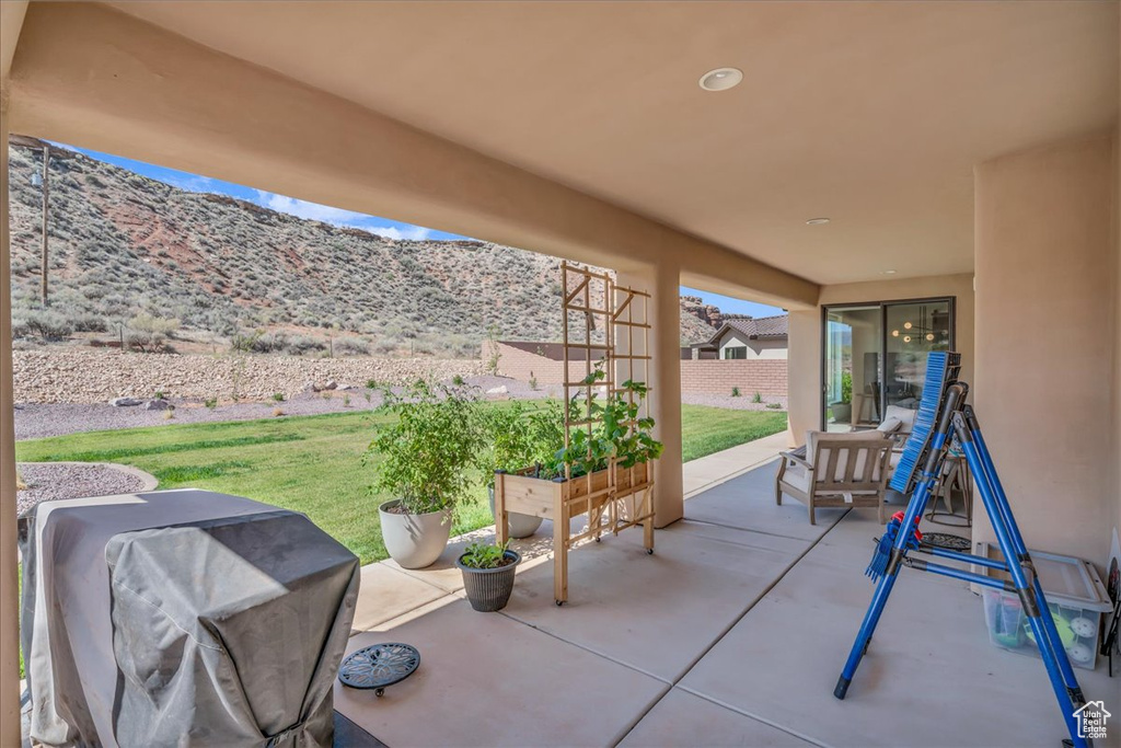 View of patio featuring grilling area and a mountain view
