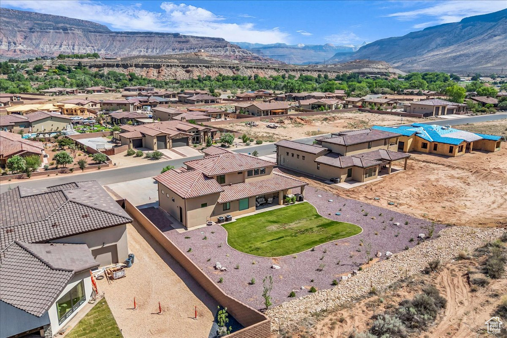 Aerial view of residential area with a mountainous background