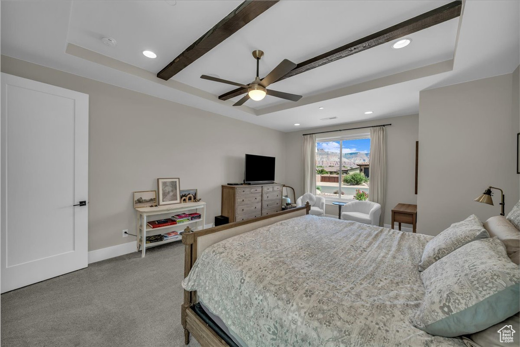 Carpeted bedroom featuring recessed lighting, beam ceiling, ceiling fan, and a raised ceiling