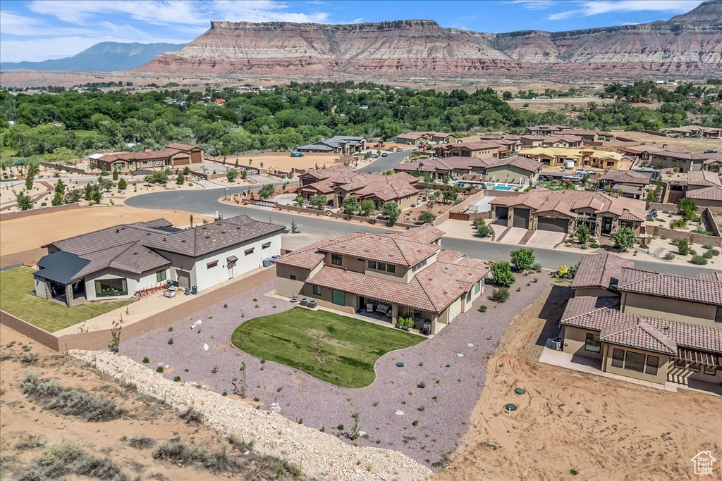 Aerial view of residential area with a mountain backdrop