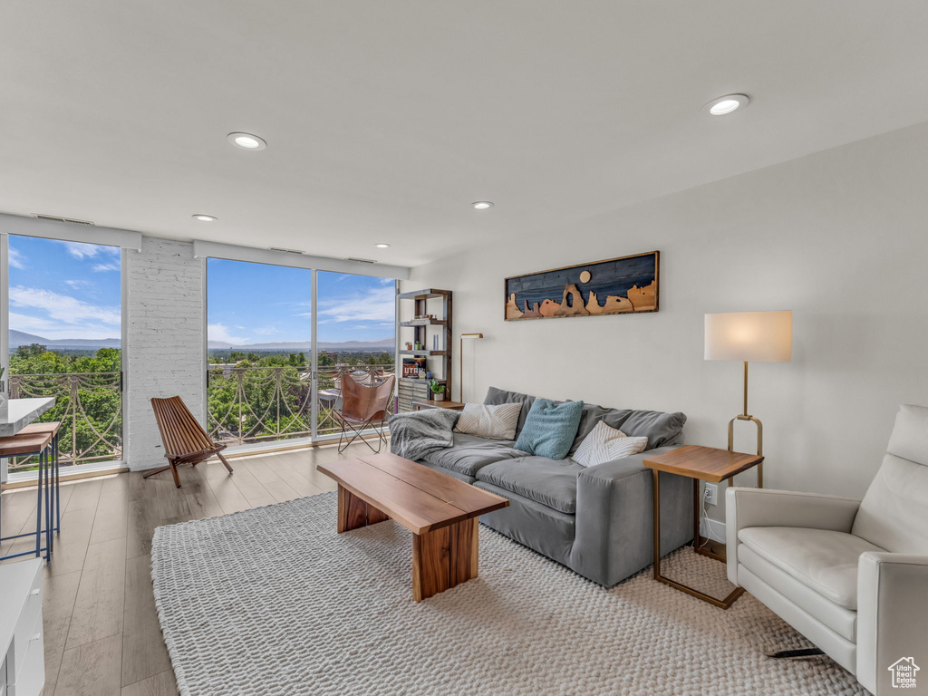 Living area featuring wood finished floors and recessed lighting
