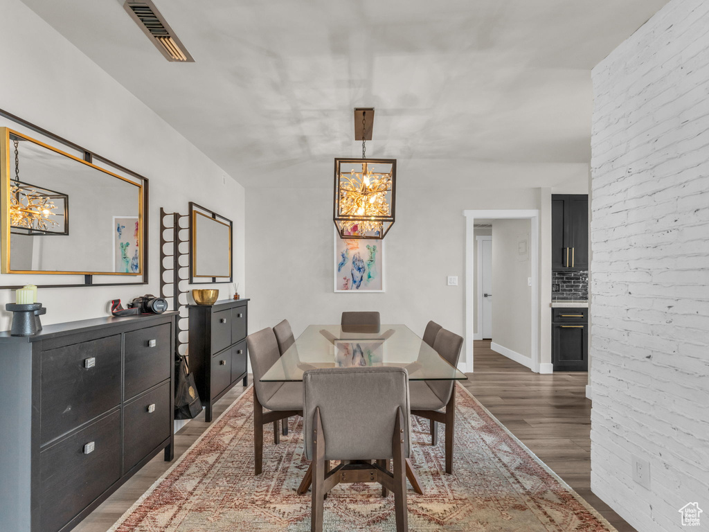 Dining room featuring a chandelier and wood finished floors