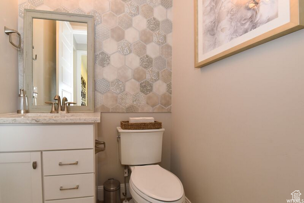 Bathroom featuring vanity and toilet