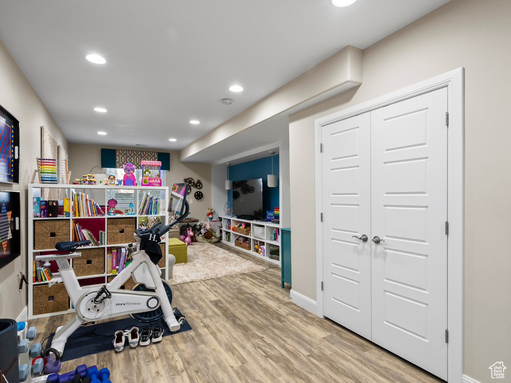 Exercise room featuring recessed lighting and wood finished floors