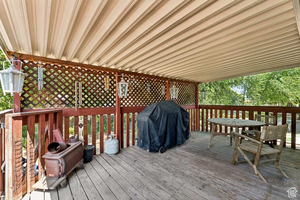 Deck featuring area for grilling and outdoor dining area