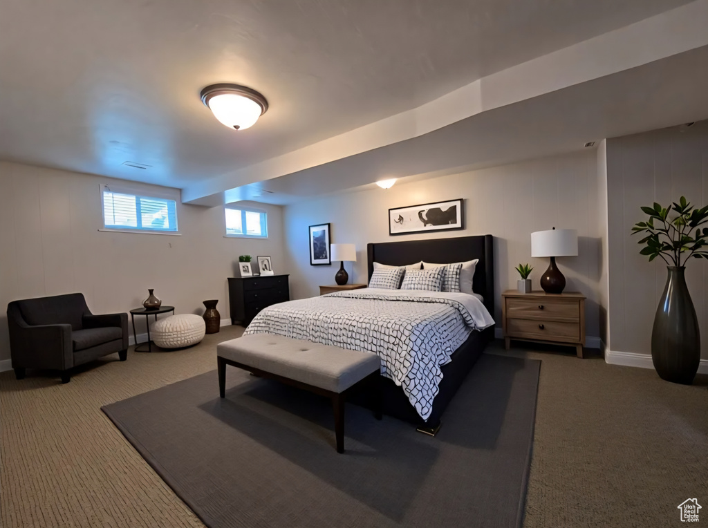 Carpeted bedroom featuring baseboards