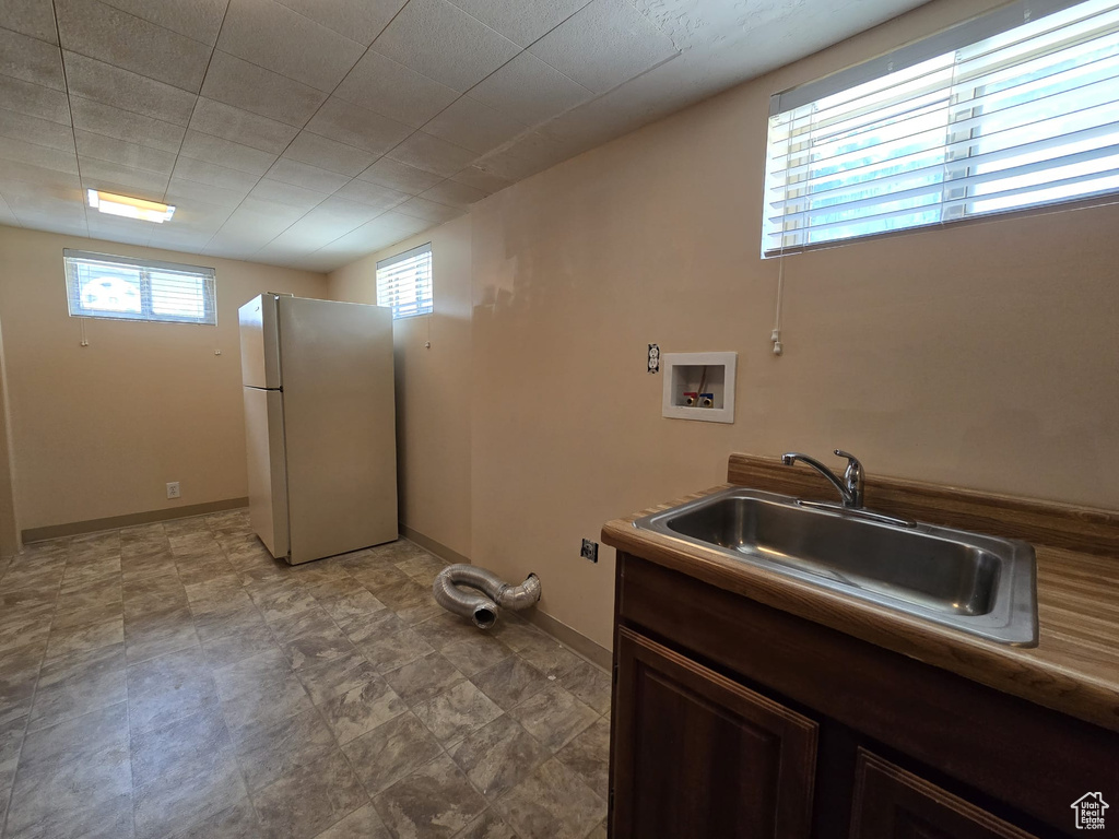 Laundry area featuring plenty of natural light and washer hookup