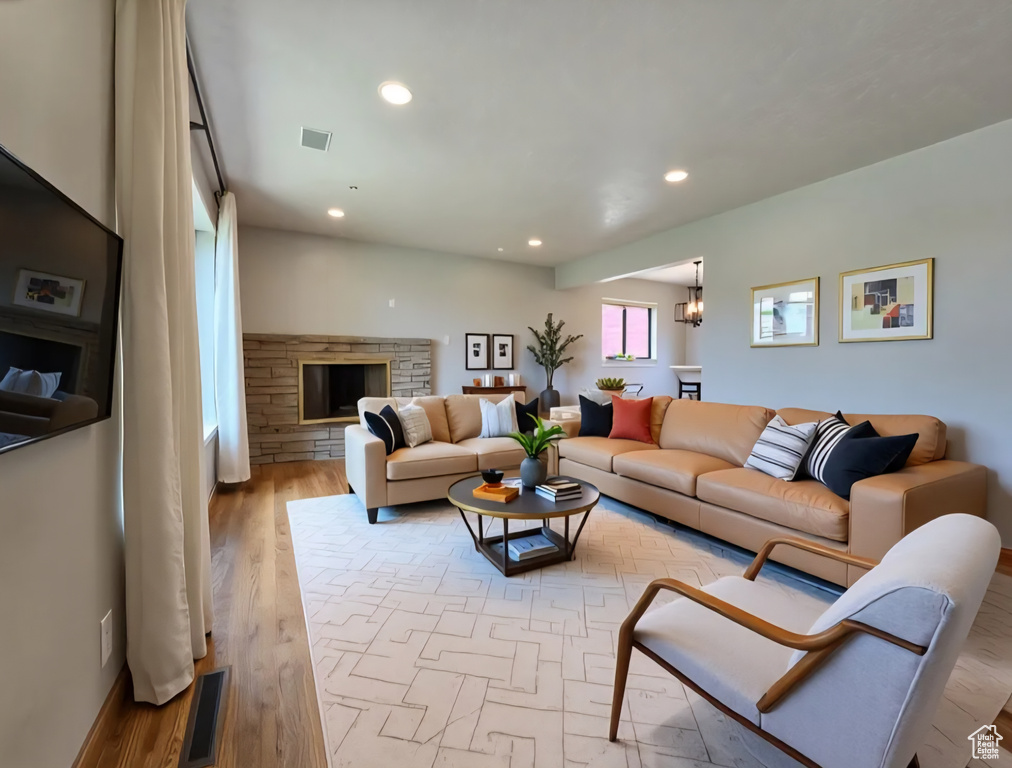 Living room with recessed lighting and wood finished floors