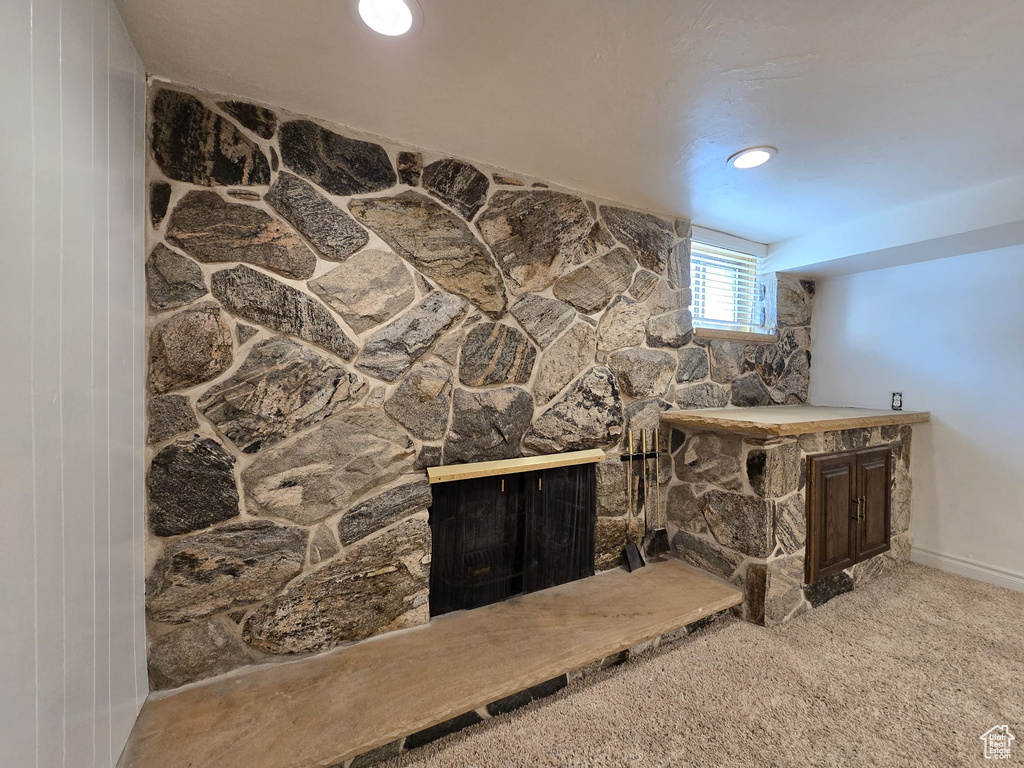 Detailed view of carpet flooring and baseboards