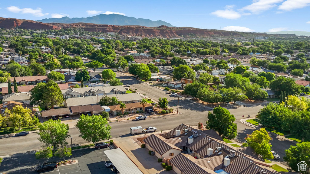 Aerial view of residential area featuring a mountain backdrop