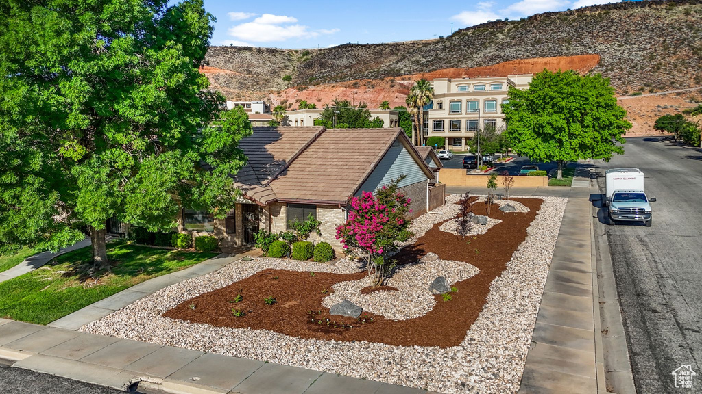 View from above of property with a mountain backdrop